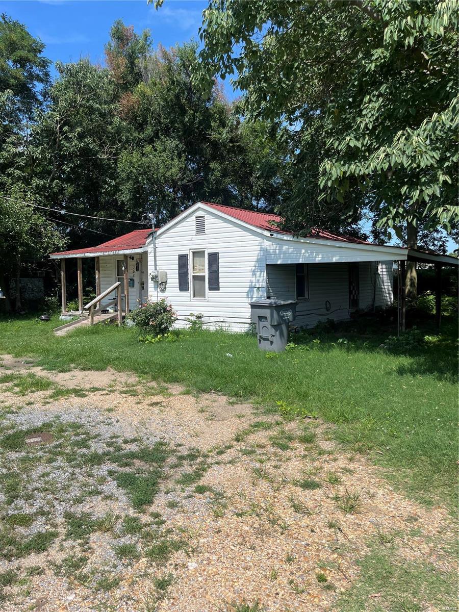 view of home's exterior with a yard