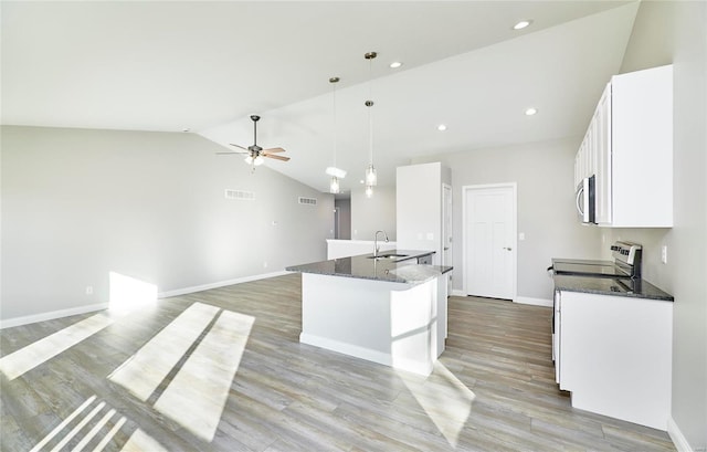 kitchen with white cabinetry, appliances with stainless steel finishes, sink, and hanging light fixtures