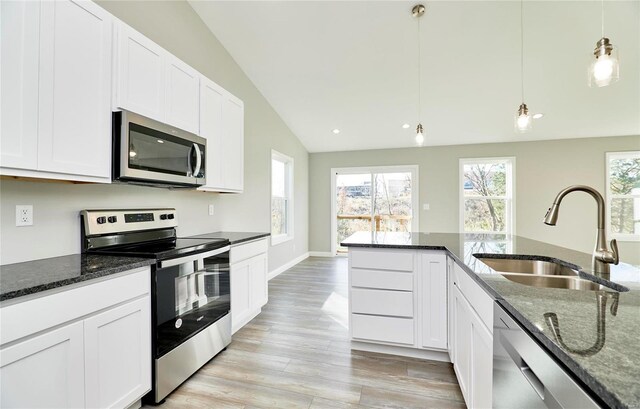 kitchen with white cabinetry, sink, pendant lighting, and appliances with stainless steel finishes