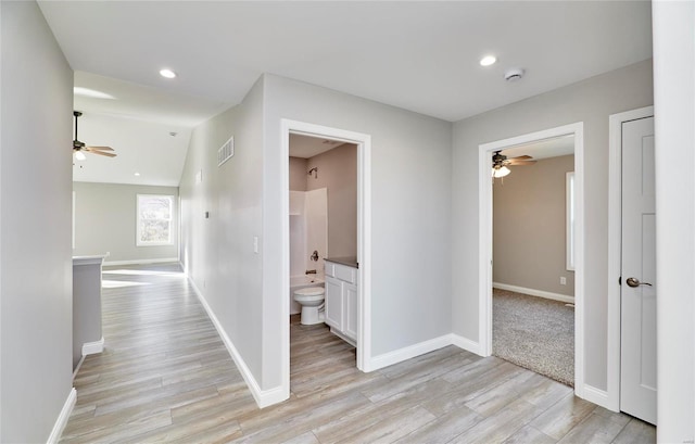 hallway featuring light hardwood / wood-style flooring