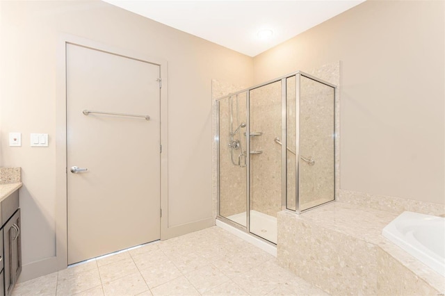 bathroom with vanity, tile patterned flooring, and separate shower and tub