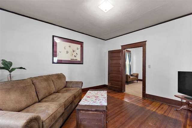 living room with dark hardwood / wood-style floors and ornamental molding