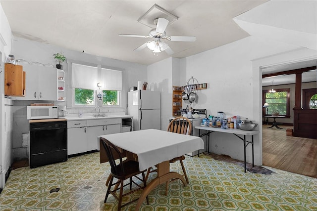 kitchen featuring white cabinets, ceiling fan, white appliances, and sink