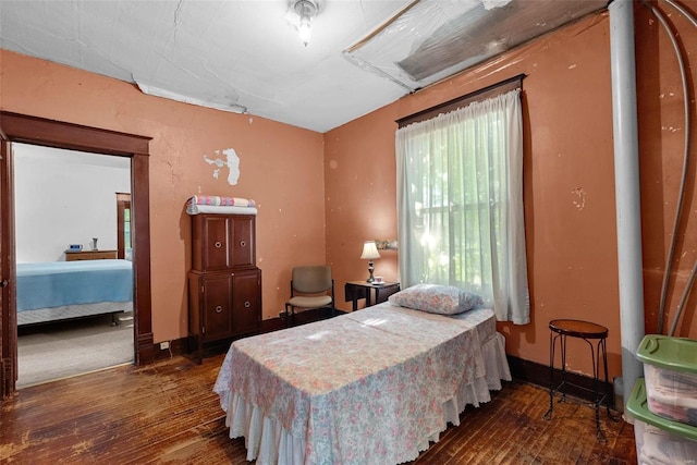 bedroom featuring dark hardwood / wood-style floors