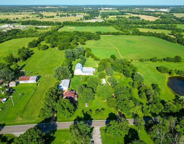 birds eye view of property with a rural view