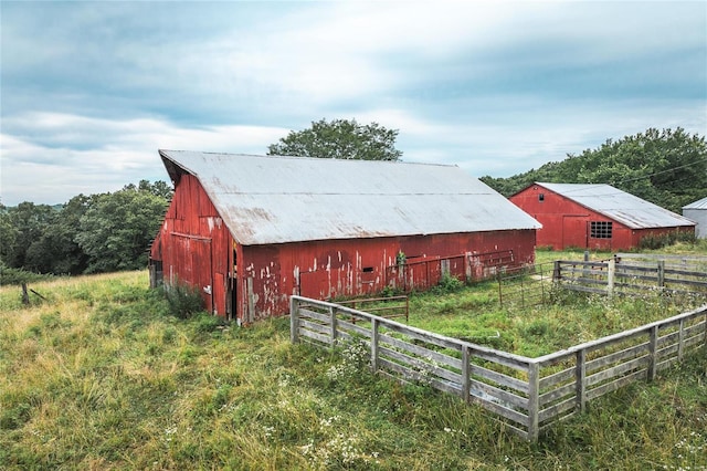 view of outbuilding with a rural view