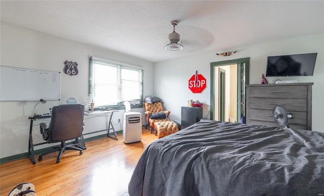 bedroom featuring light hardwood / wood-style flooring and ceiling fan