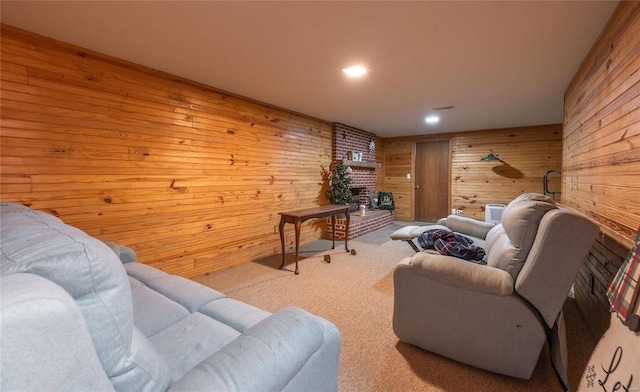 living room featuring wood walls and carpet floors