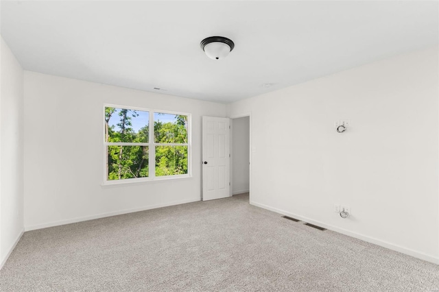 spare room featuring carpet flooring