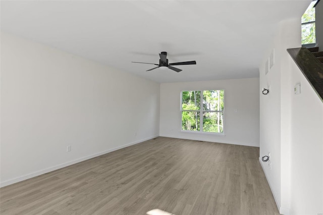 unfurnished room featuring ceiling fan and light wood-type flooring