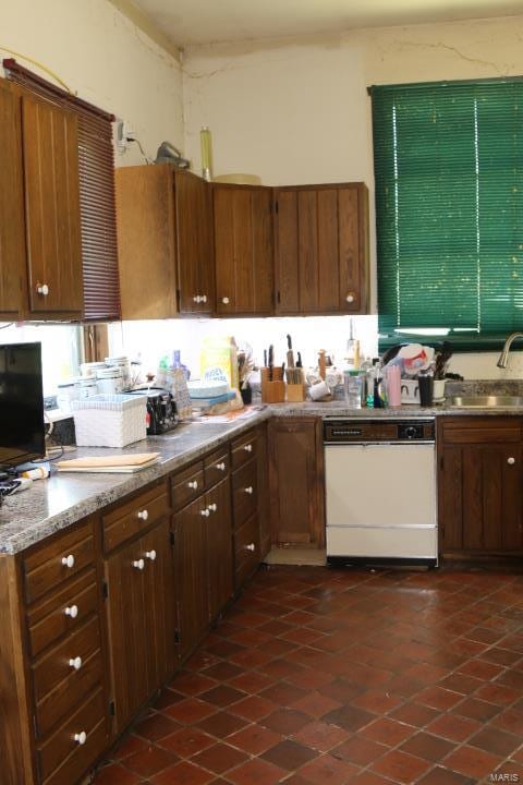 kitchen with white dishwasher and sink