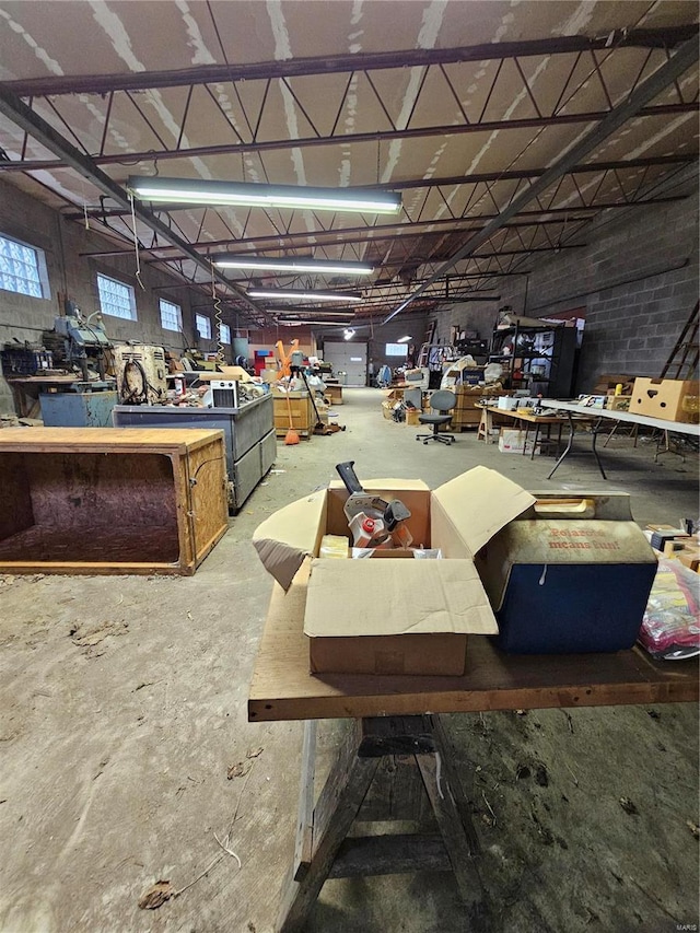 misc room featuring a workshop area and concrete flooring