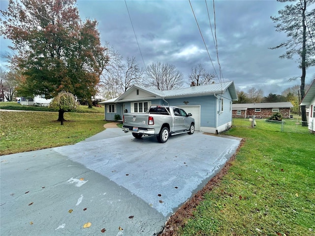 exterior space with a front lawn and a garage