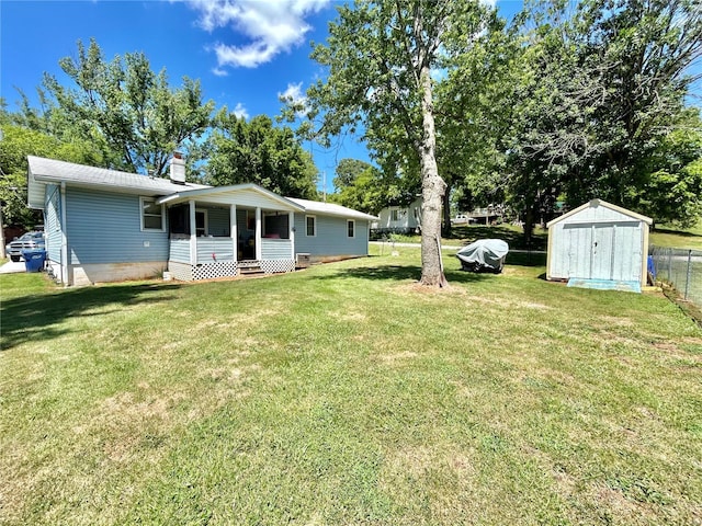 view of yard featuring a porch and a storage unit