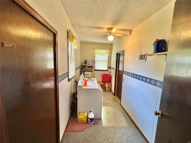 hallway with a textured ceiling