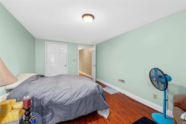 bedroom with hardwood / wood-style floors