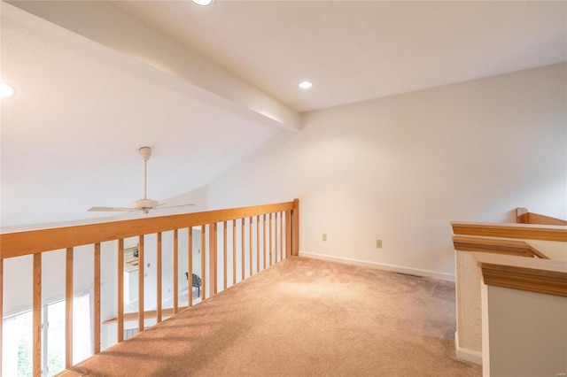 bonus room featuring light colored carpet, lofted ceiling with beams, and ceiling fan