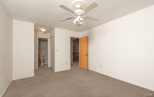 unfurnished room with ceiling fan and carpet flooring