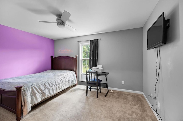 bedroom featuring light colored carpet and ceiling fan