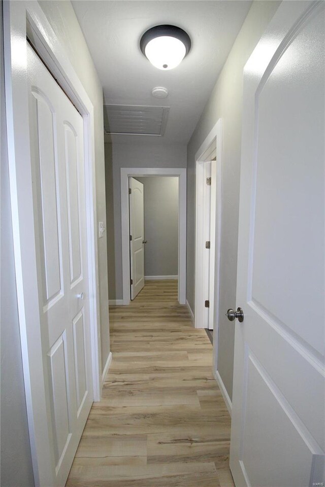 hallway with light wood-type flooring