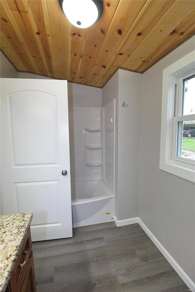 bathroom with shower / bathtub combination, vanity, hardwood / wood-style flooring, and wood ceiling