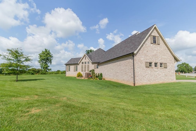 view of side of property featuring a yard