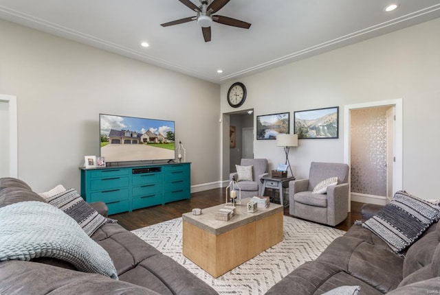 living room with ceiling fan and dark hardwood / wood-style flooring