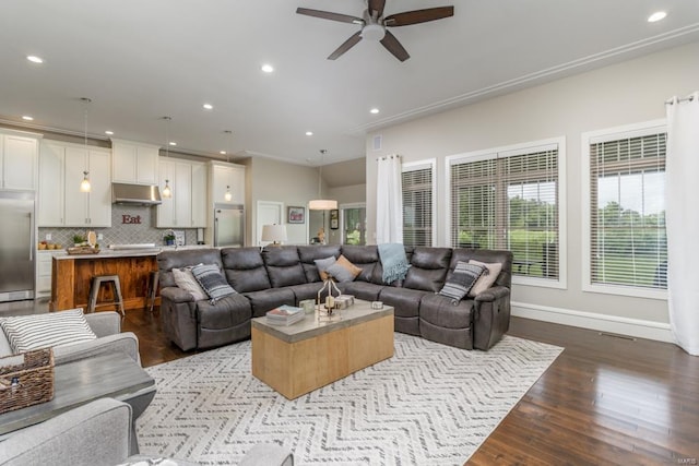 living room featuring hardwood / wood-style flooring and ceiling fan