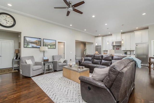 living room with dark hardwood / wood-style floors, ceiling fan, and ornamental molding