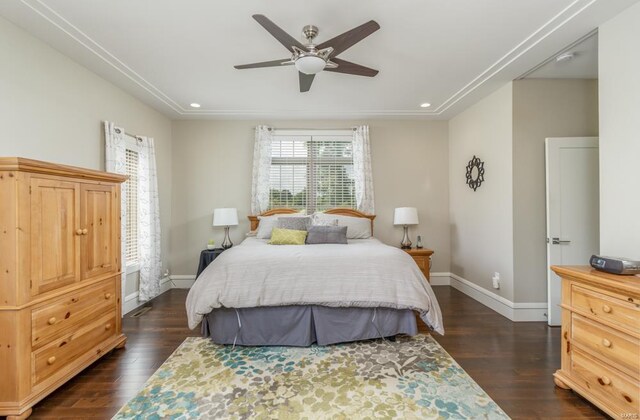 bedroom featuring multiple windows, ceiling fan, and dark hardwood / wood-style floors