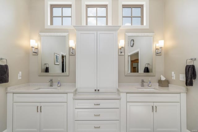 bathroom featuring vanity and plenty of natural light