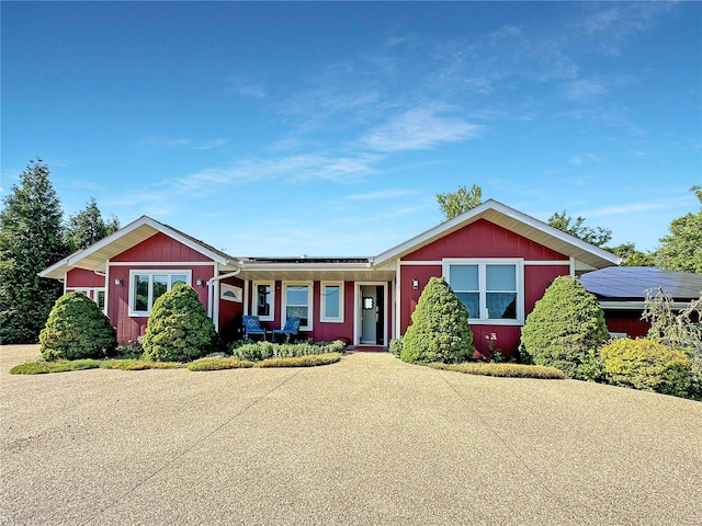 view of front of house featuring solar panels