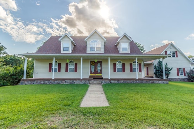 cape cod-style house with covered porch and a front lawn