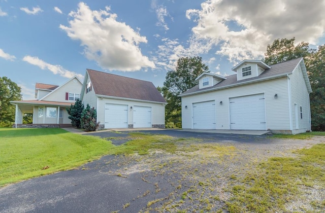 garage featuring a yard