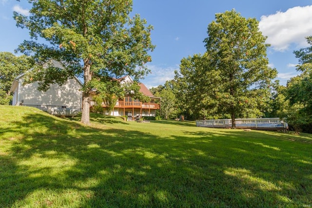 view of yard featuring a wooden deck