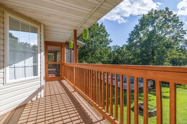 wooden terrace with a yard