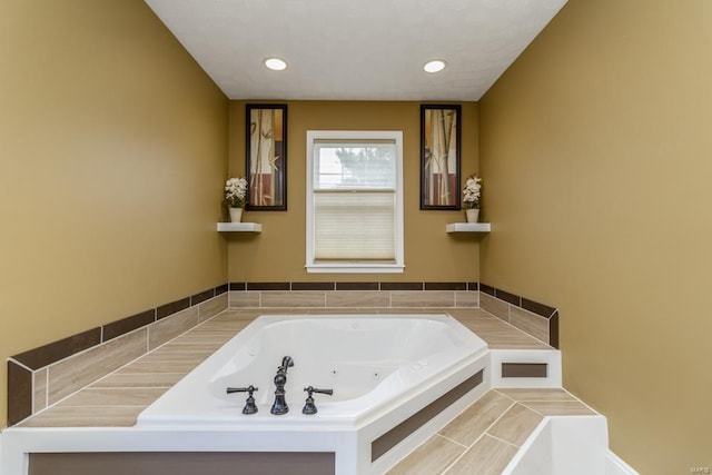 bathroom featuring a tub to relax in