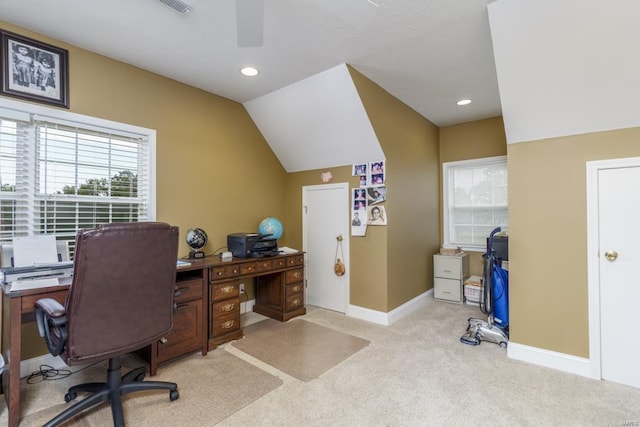 office featuring lofted ceiling and light colored carpet