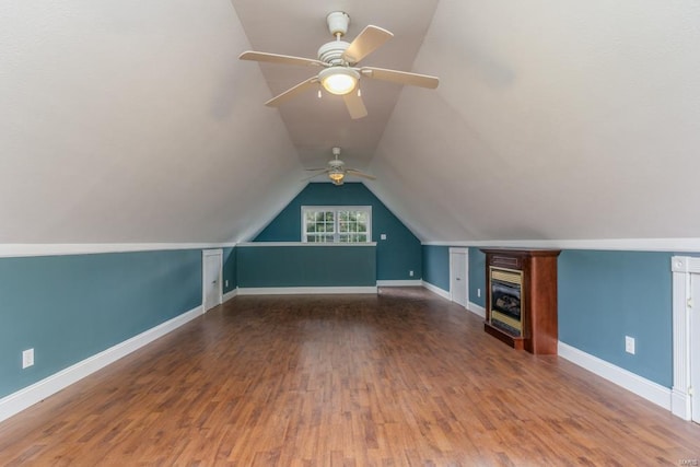 additional living space with vaulted ceiling, ceiling fan, and hardwood / wood-style floors