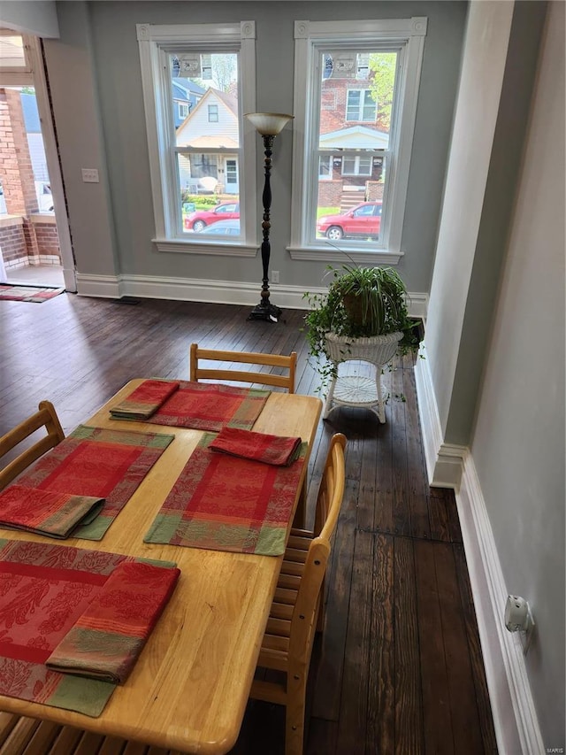 dining area featuring dark hardwood / wood-style flooring