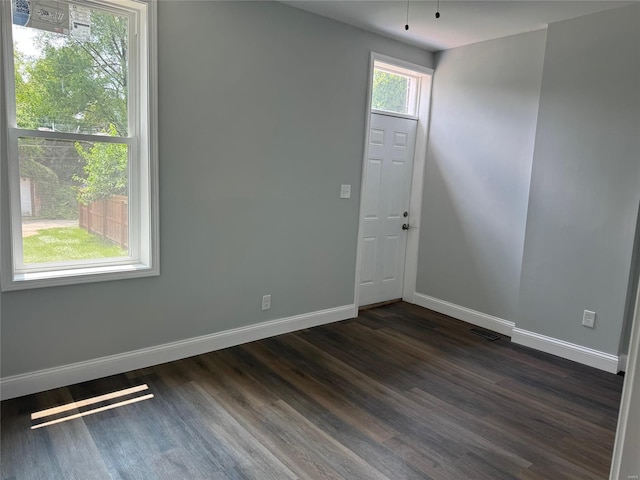 empty room featuring dark hardwood / wood-style floors