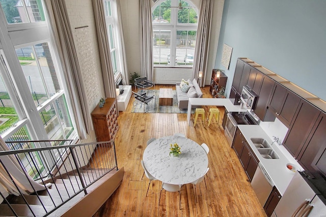 interior space with sink and light hardwood / wood-style flooring