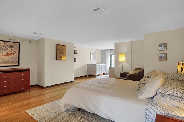 bedroom featuring light wood-type flooring