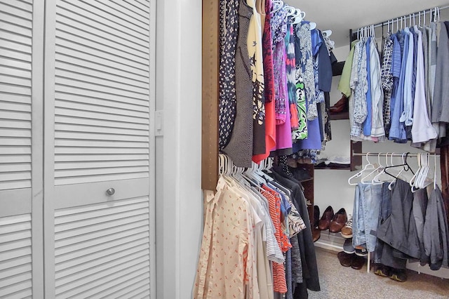 walk in closet featuring carpet floors