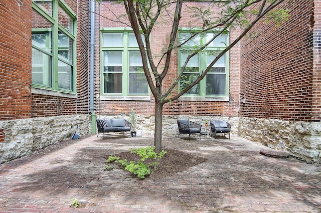 view of home's exterior featuring an outdoor hangout area and a patio