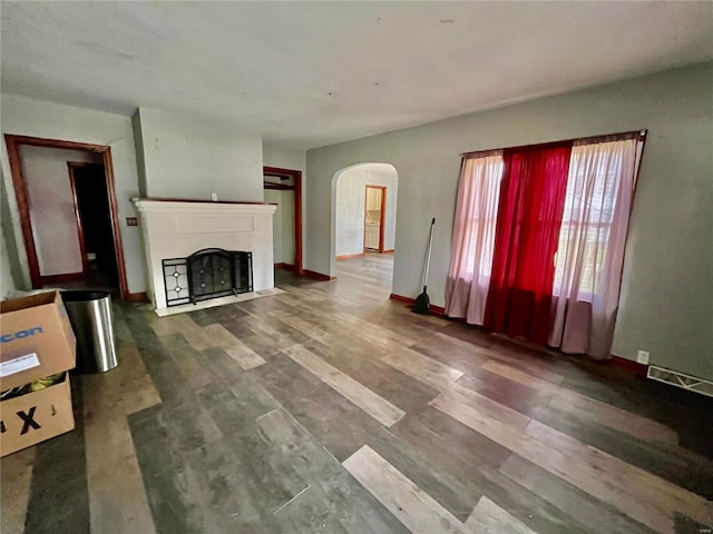 unfurnished living room with hardwood / wood-style floors