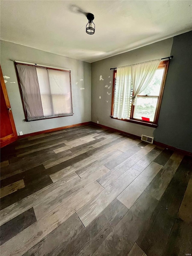 empty room with wood-type flooring