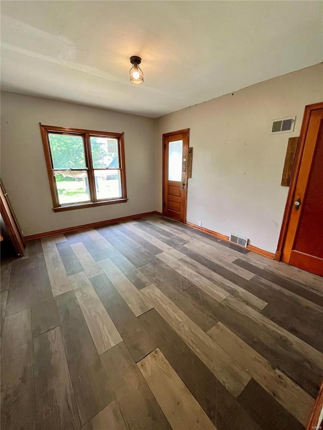 spare room with dark hardwood / wood-style floors