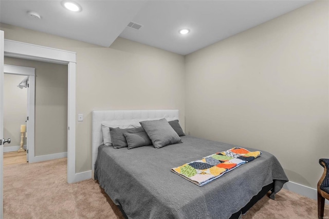 bedroom with carpet floors, recessed lighting, visible vents, and baseboards