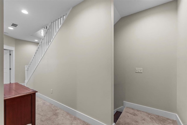 stairway featuring recessed lighting, carpet flooring, visible vents, and baseboards